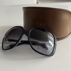 Authentic Gucci sunglasses with leather case. Navy blue/purple frame.